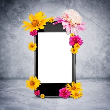 Smartphone with flowers on grey wall background
