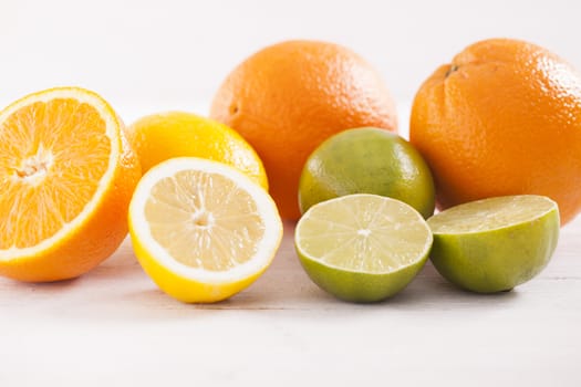 Healthy and fresh mixed juice from fruits on white wooden table