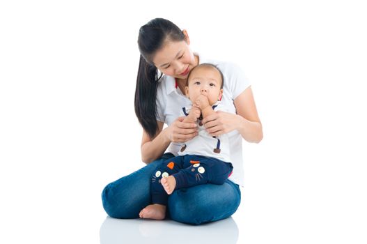 Asian mother and baby indoor portrait