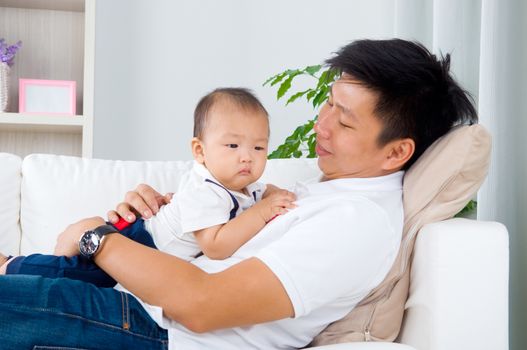 Asian father and baby