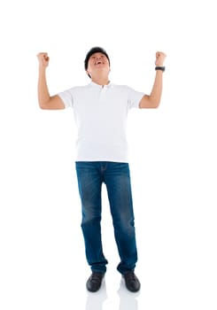 Portrait of excited asian businessman celebrating success over white background