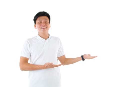 portrait of young happy smiling cheerful asian business man hand showing blank copy space; isolated over white background