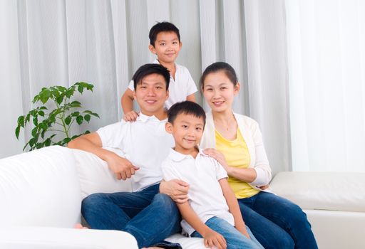 Indoor portrait of asian family