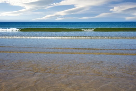 calm soft waves lashing onto ballybunion beach in county kerry ireland