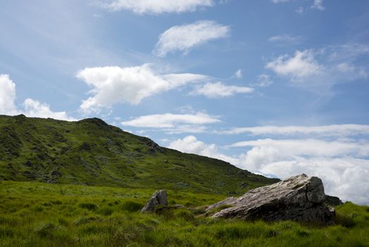 view from a beautiful hiking route the kerry way in ireland of rocky and green landscape