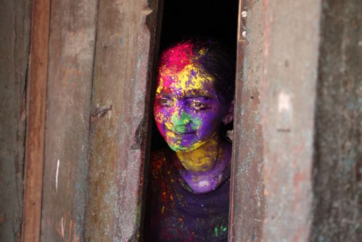 INDIA, Allahabad: A child wears vibrantly colored paints during Holi celebrations in Allahabad, India on March 24, 2016. Hindu devotees splatter each other with paint during Holi celebrations to mark the advent of spring. It is celebrated across the country and in many other countries in the region.