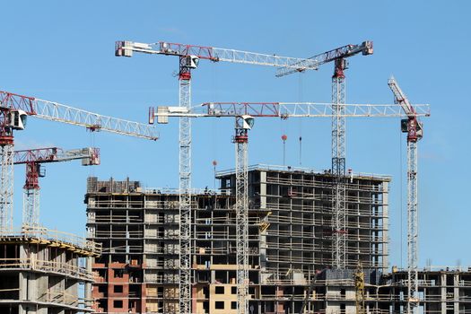 tower cranes on the construction of the building 