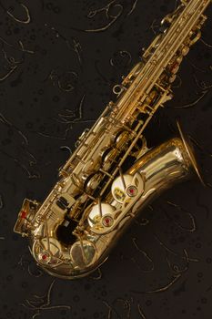 Golden saxophone  on a black background