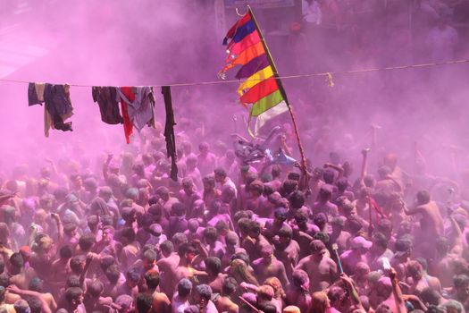 INDIA, Pushkar: Colors fly as Hindu devotees throw vibrantly colored paints during Holi celebrations in Pushkar, Rajasthan, India on March 24, 2016. Holi is the festival of colors that also marks the advent of spring. It is celebrated across the country and in many other countries in the region.