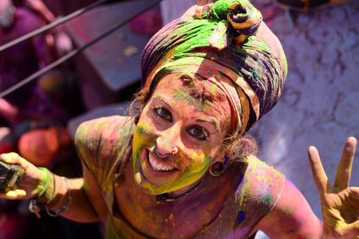 INDIA, Pushkar: A reveler wears vibrantly colorful paints during the Hindu Holi celebrations in Pushkar, Rajasthan, India on March 24, 2016. Holi is the festival of colors that also marks the advent of spring. It is celebrated across the country and in many other countries in the region.