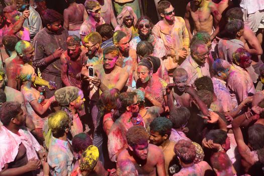 INDIA, Pushkar: Hindu devotees are covered in colorful paints during Holi celebrations in Pushkar, Rajasthan, India on March 24, 2016. Holi is the festival of colors that also marks the advent of spring. It is celebrated across the country and in many other countries in the region.