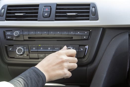 close-up of a girl's hand on the dashboard in a car