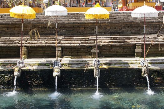 BALI, INDONESIA - DECEMBER 01, 2015: Holy springs of Pura Tirta Empul, one of the sights of Bali on December 01, 2015 in Bali, Indonesia