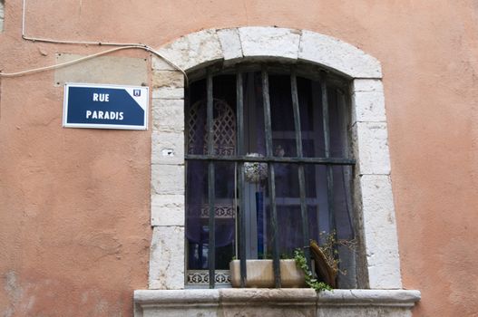  Little street with paradise street sign on house France Provence