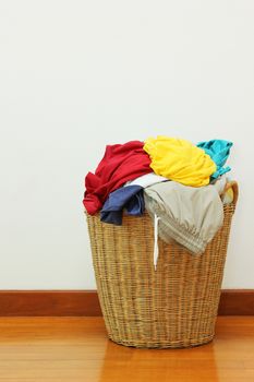 Clothing in laundry basket made of rattan