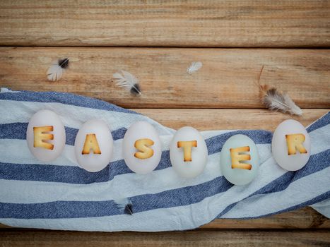 Easter eggs on the nest. Easter eggs for Easter holidays design. Easter eggs with abc cookie text.