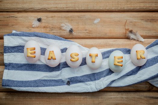 Easter eggs on the napkin. Easter eggs for Easter holidays design. Easter eggs with abc cookie text.