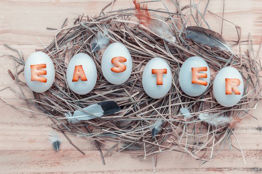 Easter eggs on the nest. Easter eggs for Easter holidays design. Easter eggs with abc cookie text.