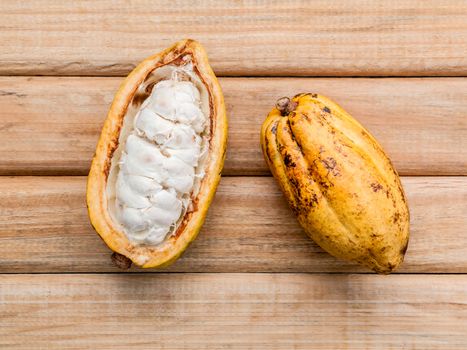 Ripe Indonesia's cocoa  setup on rustic wooden background.