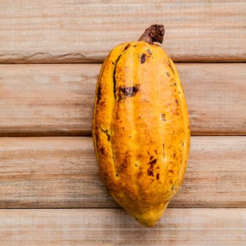 Ripe Indonesia's cocoa  setup on rustic wooden background.