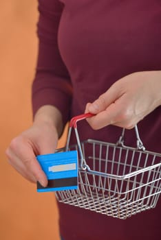 Shopping Cart and woman holding credit