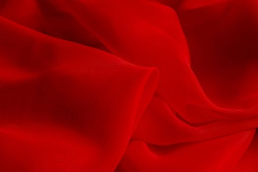 the texture of the red fabric from the delicate chiffon