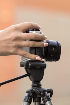 the girl in the hands of is holding the vintage camera