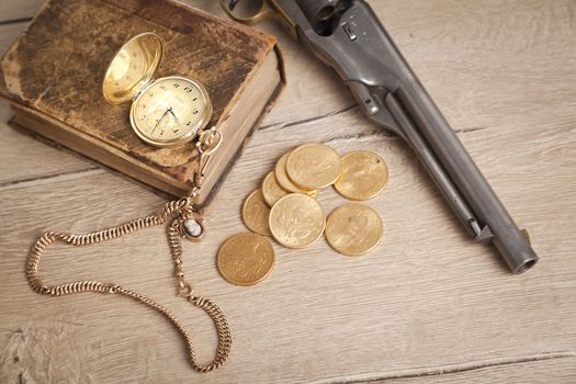 gambling and crime concept with gun, cards and golden coins