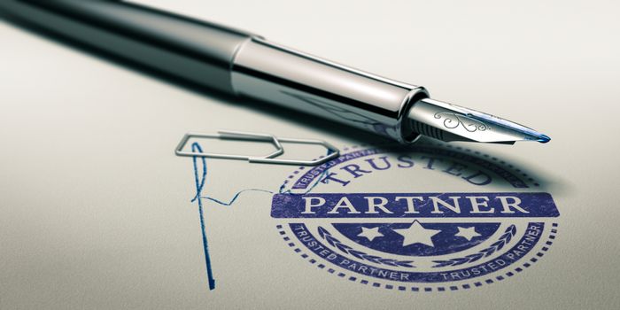 Trusted partner mark imprinted on a paper texture with signature and fountain pen. Concept image for illustration of trust in partnership and business services.