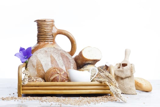 Freshly baked bread,honey and eggs on wooden vintage table