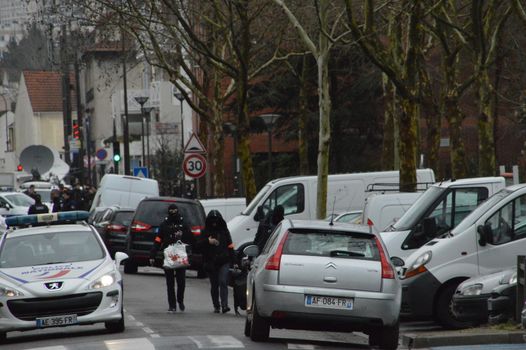 FRANCE, Argenteuil: Police officers walk in a street after a raid in the Argenteuil neighbourhood northwest of Paris on March 25, 2016. French Interior Minister Bernard Cazeneuve said police had arrested a suspect in the Paris area today who was in the advanced stages of a plot to attack France.