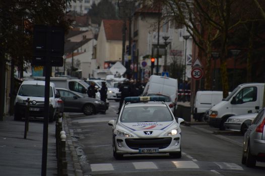 FRANCE, Argenteuil: A police car patrol after a raid in the Argenteuil neighbourhood northwest of Paris on March 25, 2016. French Interior Minister Bernard Cazeneuve said police had arrested a suspect in the Paris area today who was in the advanced stages of a plot to attack France.