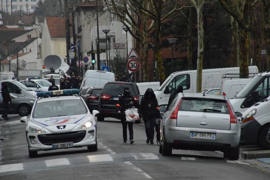 FRANCE, Argenteuil: Police officers walk in a street after a raid in the Argenteuil neighbourhood northwest of Paris on March 25, 2016. French Interior Minister Bernard Cazeneuve said police had arrested a suspect in the Paris area today who was in the advanced stages of a plot to attack France.