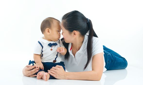 Asian mother and baby indoor portrait