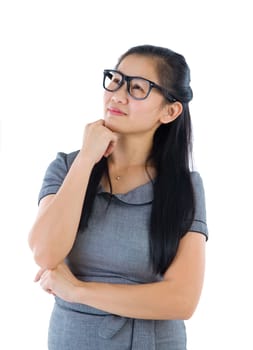 Businesswoman having a thought, looking up smiling happy. Portrait of beautiful Asian female model standing isolated on white background.