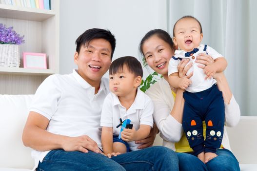 Indoor portrait of asian family