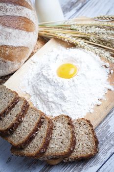 Freshly baked bread rolls, wheat ears and honey