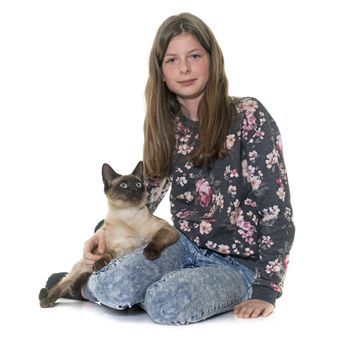 child and siamese cat in front of white background