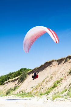 paraglider on the blue sky