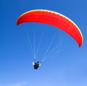 paraglider on the blue sky