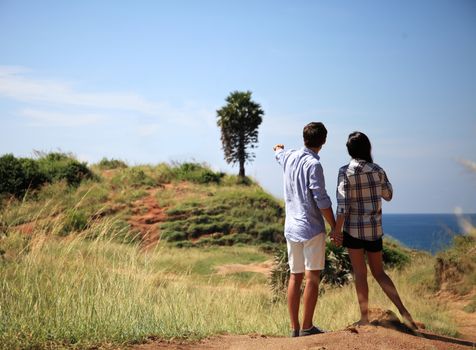 Young couple enjoy beautiful sea view on vacation