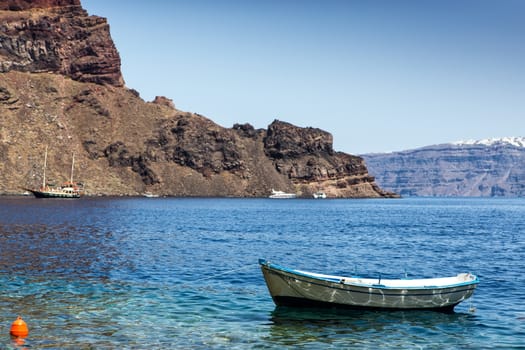 Lonely fishing boat at coastline of Aegean sea, Greece