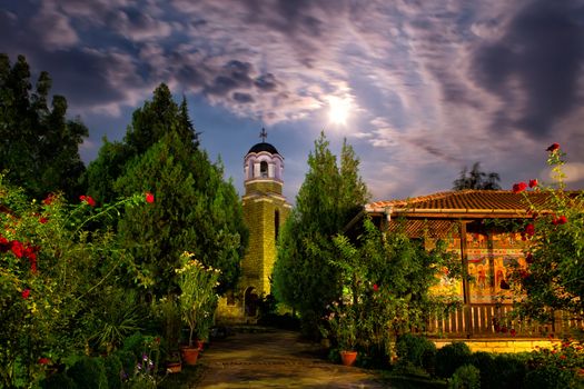 Old christian monastery at summer night