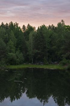 Lake in the stone canyon surrounded by forest