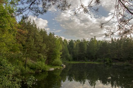 Lake in the stone canyon surrounded by forest