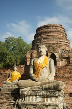a buddha at the Wat yai chai mongkhon in the city of Ayutthaya north of bangkok in Thailand in southeastasia.