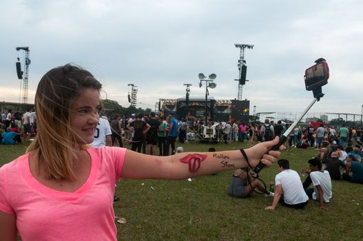 CUBA, Havana: Rolling Stones fans wait for the start of a free concert on March 25, 2016 in Havana, Cuba. Thousands of fans waited for the Rolling Stones to play for the first time in Cuba, after the music was once banned by the government.