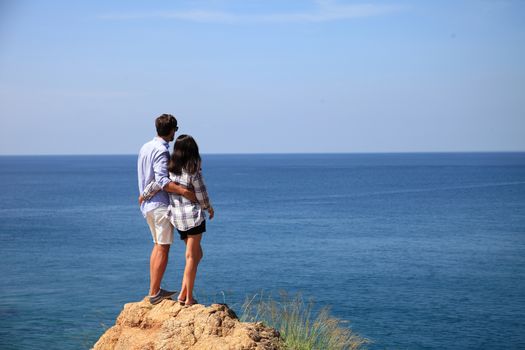 Young couple enjoy beautiful sea view on vacation