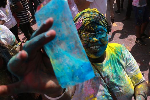 MALAYSIA, Kuala Lumpur: Revellers dance and spray colored powder during the Holi Festival in Kuala Lumpur on March 26, 2016. Holi, also called the Festival of Colours, is a popular Hindu spring festival observed in India, Malaysia and other countries at the end of the winter season on the last full moon day of the lunar month. 
