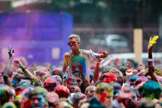 MALAYSIA, Kuala Lumpur: Revellers dance and spray colored powder during the Holi Festival in Kuala Lumpur on March 26, 2016. Holi, also called the Festival of Colours, is a popular Hindu spring festival observed in India, Malaysia and other countries at the end of the winter season on the last full moon day of the lunar month. 